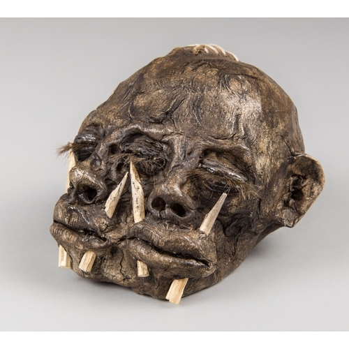A 20TH CENTURY IMITATION DIPROSOPUS (TWO-FACED) SHRUNKEN HEAD (h 9.5cm x w 14cm x d 11.5cm)