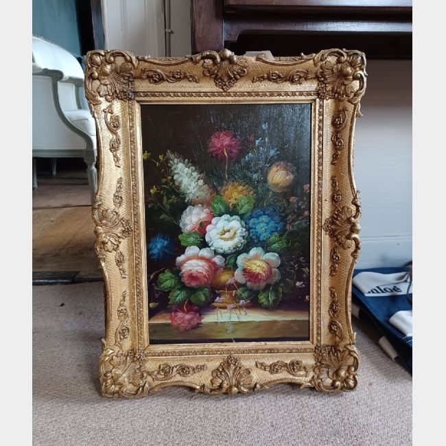 Oil on board of flowers in gilt frame