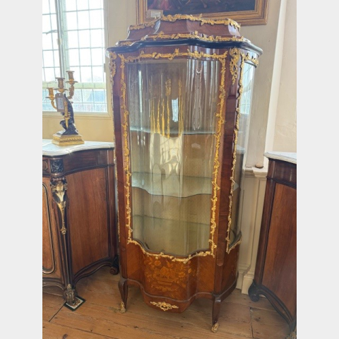 A 19th century french walnut and gilded bronze display cabinet